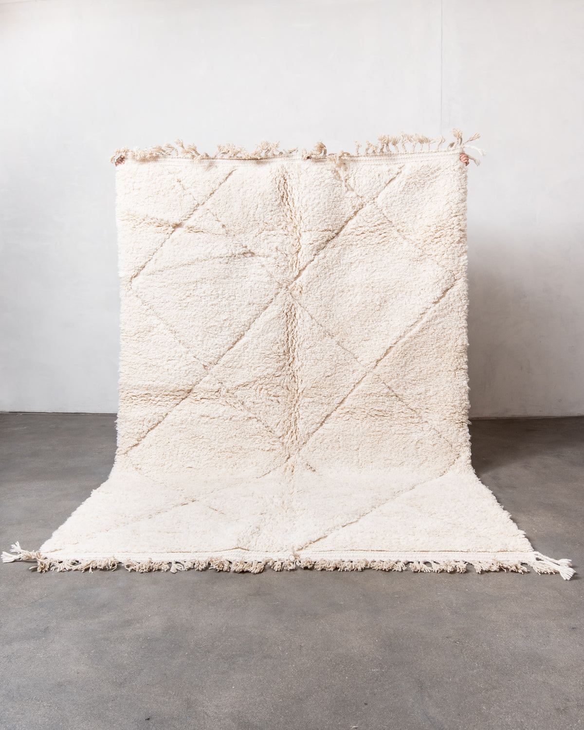 Modern, designer, handcrafted Berber rug from Morocco. Beniourain carpet with minimalist design, natural wool pile and a fluffy texture.