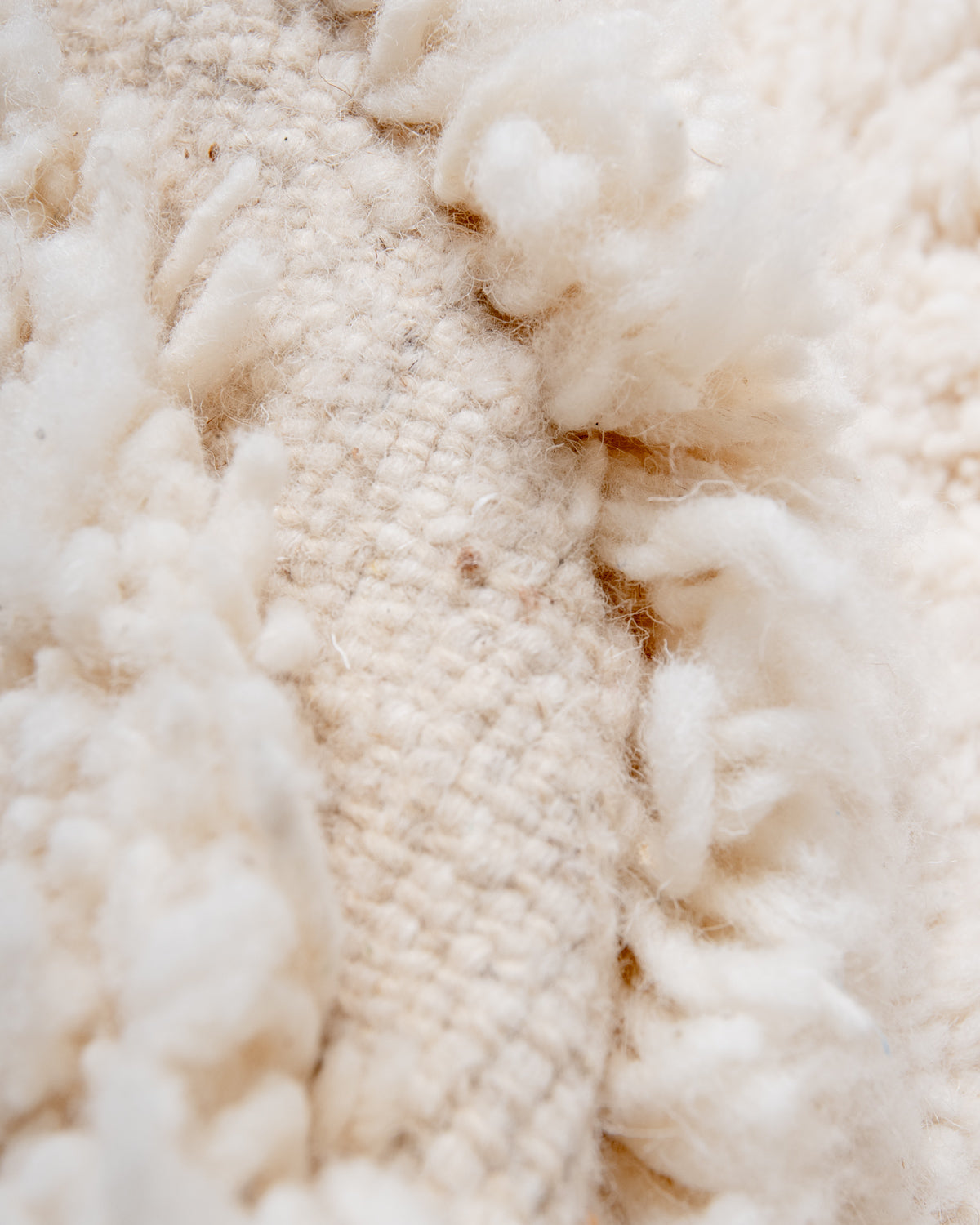 Modern, designer, handcrafted Berber rug from Morocco. Beniourain carpet with minimalist design, natural wool pile and a fluffy texture.