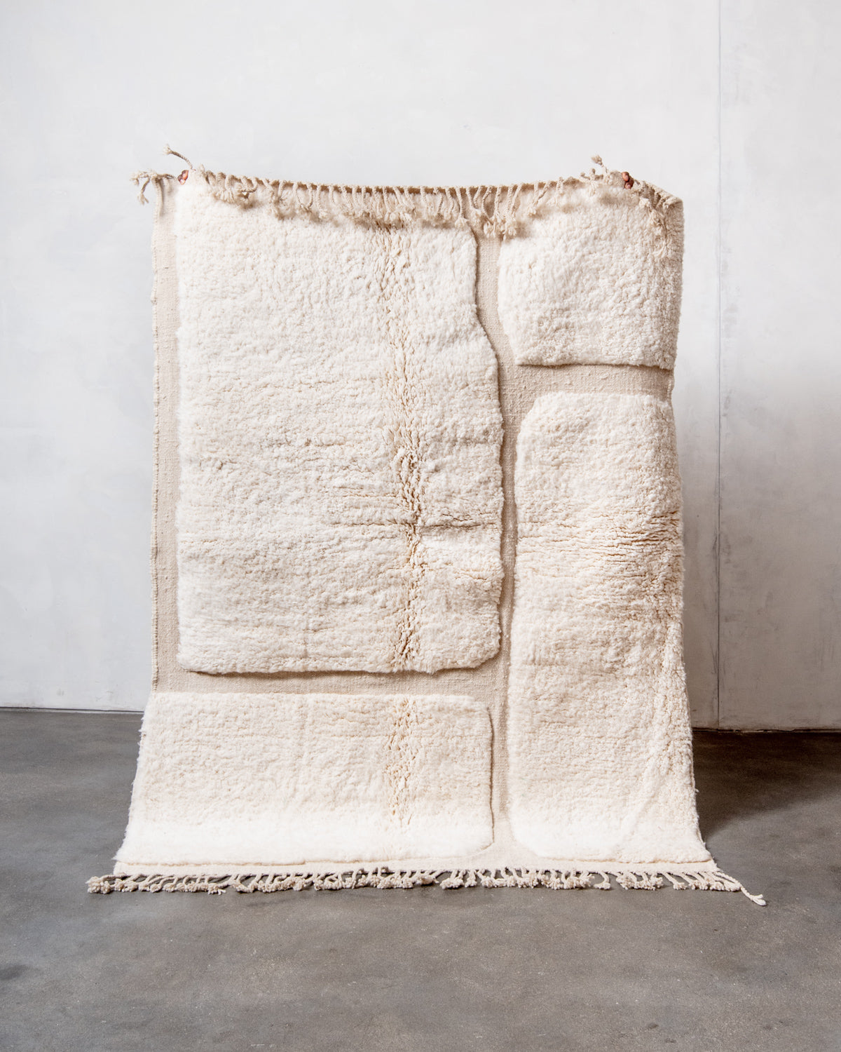 Modern, designer, handcrafted Berber rug from Morocco. Beniourain carpet with minimalist design, natural wool pile and a fluffy texture.