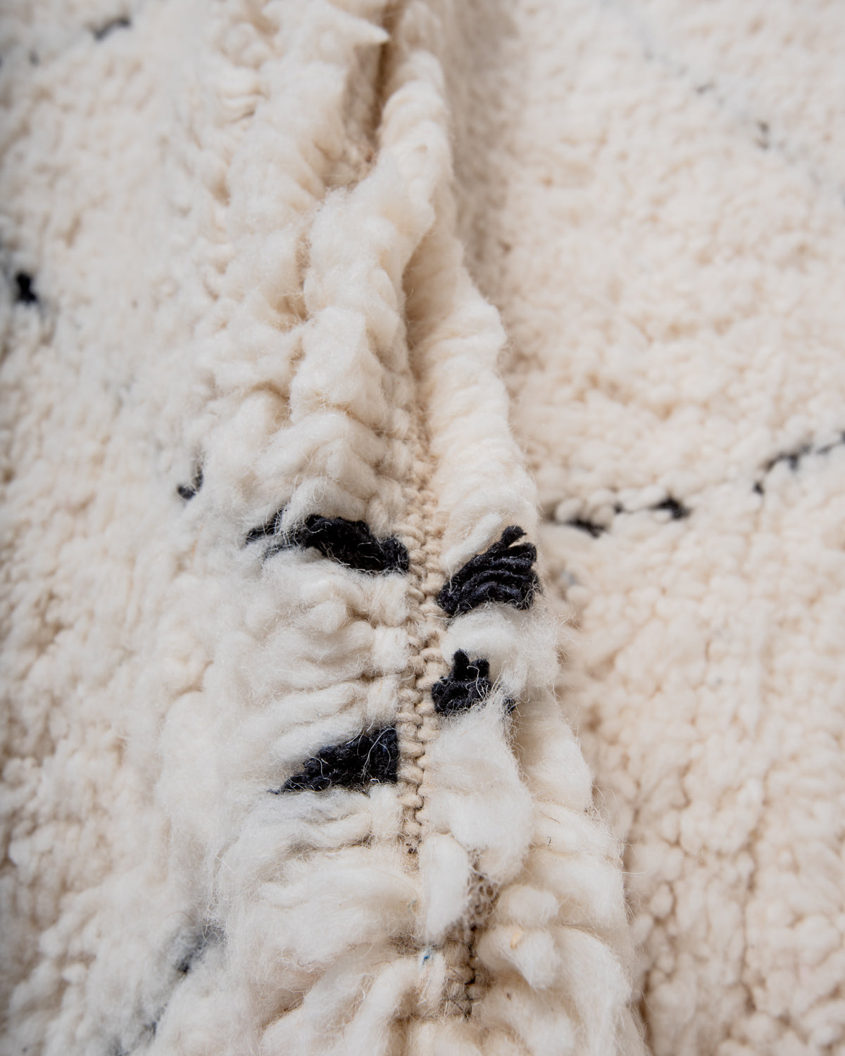 Modern, designer, handcrafted Berber rug from Morocco. Beniourain carpet with minimalist design, natural wool pile and a fluffy texture.