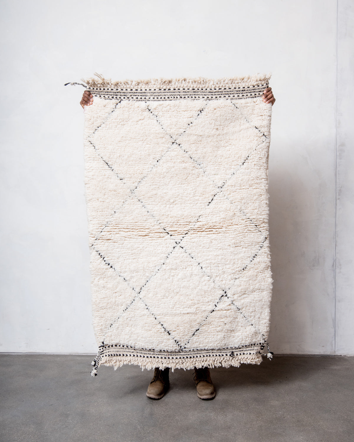 Modern, designer, handcrafted Berber rug from Morocco. Beniourain carpet with minimalist design, natural wool pile and a fluffy texture.