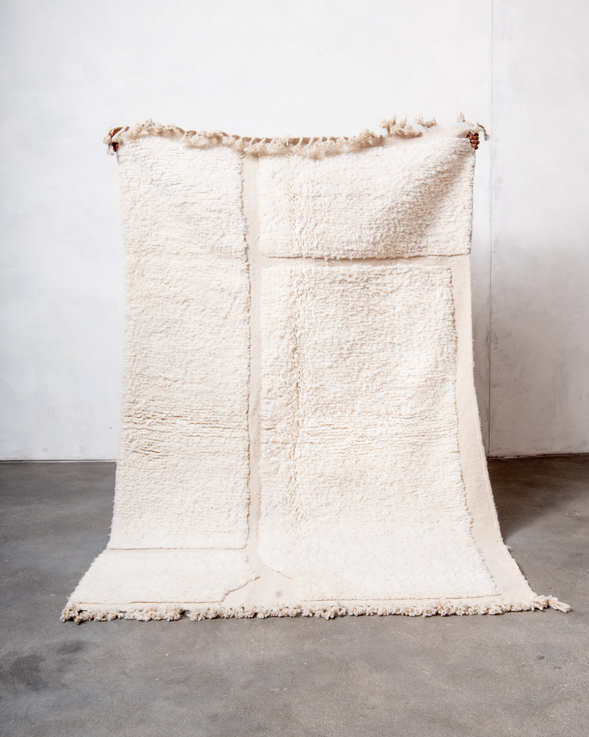 Modern, designer, handcrafted Berber rug from Morocco. Beniourain carpet with minimalist design, natural wool pile and a fluffy texture.