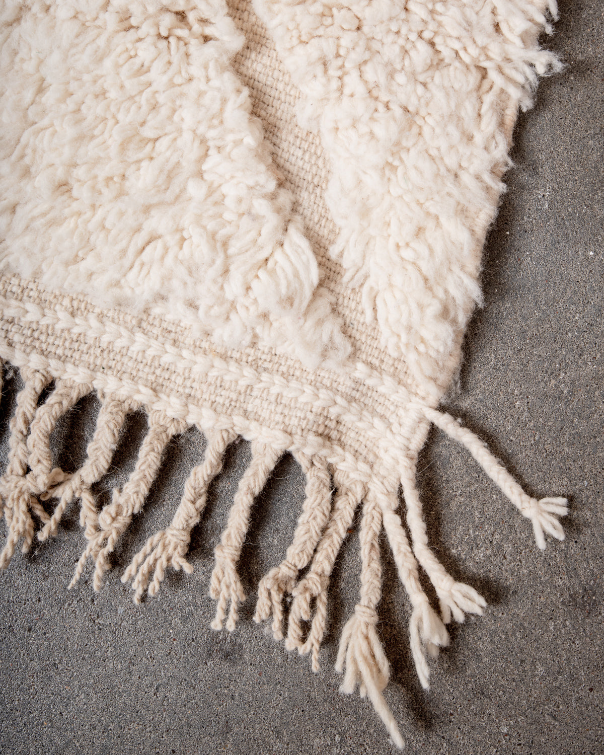 Modern, designer, handcrafted Berber rug from Morocco. Beniourain carpet with minimalist design, natural wool pile and a fluffy texture.