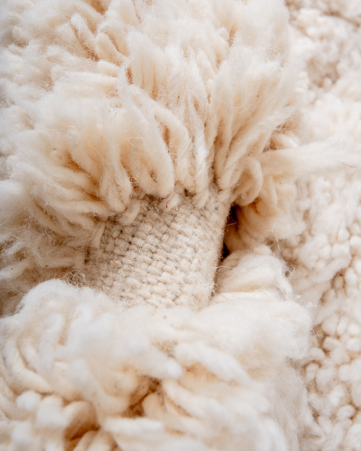 Modern, designer, handcrafted Berber rug from Morocco. Beniourain carpet with minimalist design, natural wool pile and a fluffy texture.