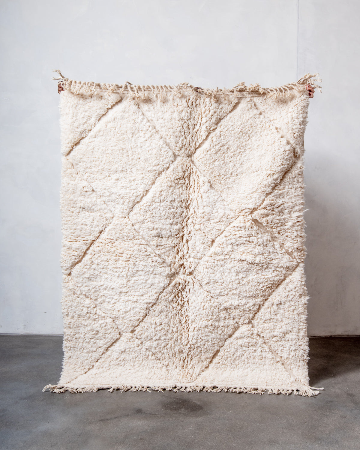 Modern, designer, handcrafted Berber rug from Morocco. Beniourain carpet with minimalist design, natural wool pile and a fluffy texture.