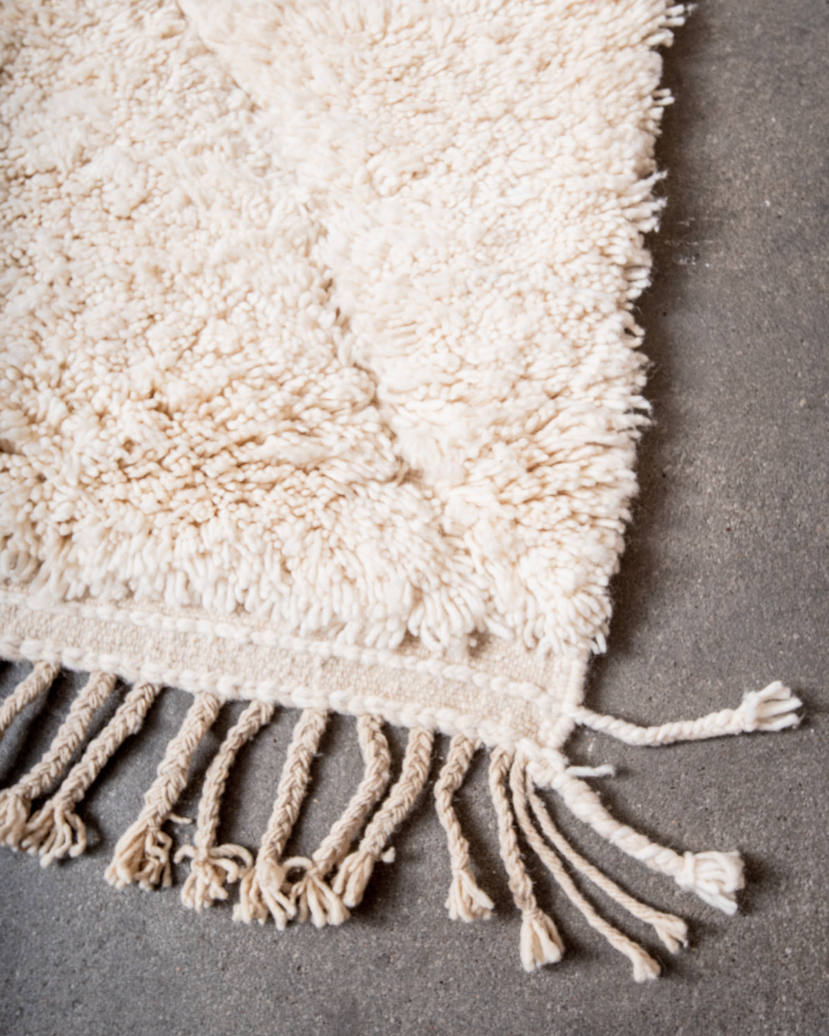 Modern, designer, handcrafted Berber rug from Morocco. Beniourain carpet with minimalist design, natural wool pile and a fluffy texture.