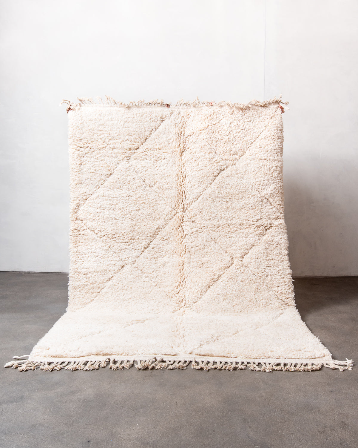 Modern, designer, handcrafted Berber rug from Morocco. Beniourain carpet with minimalist design, natural wool pile and a fluffy texture.