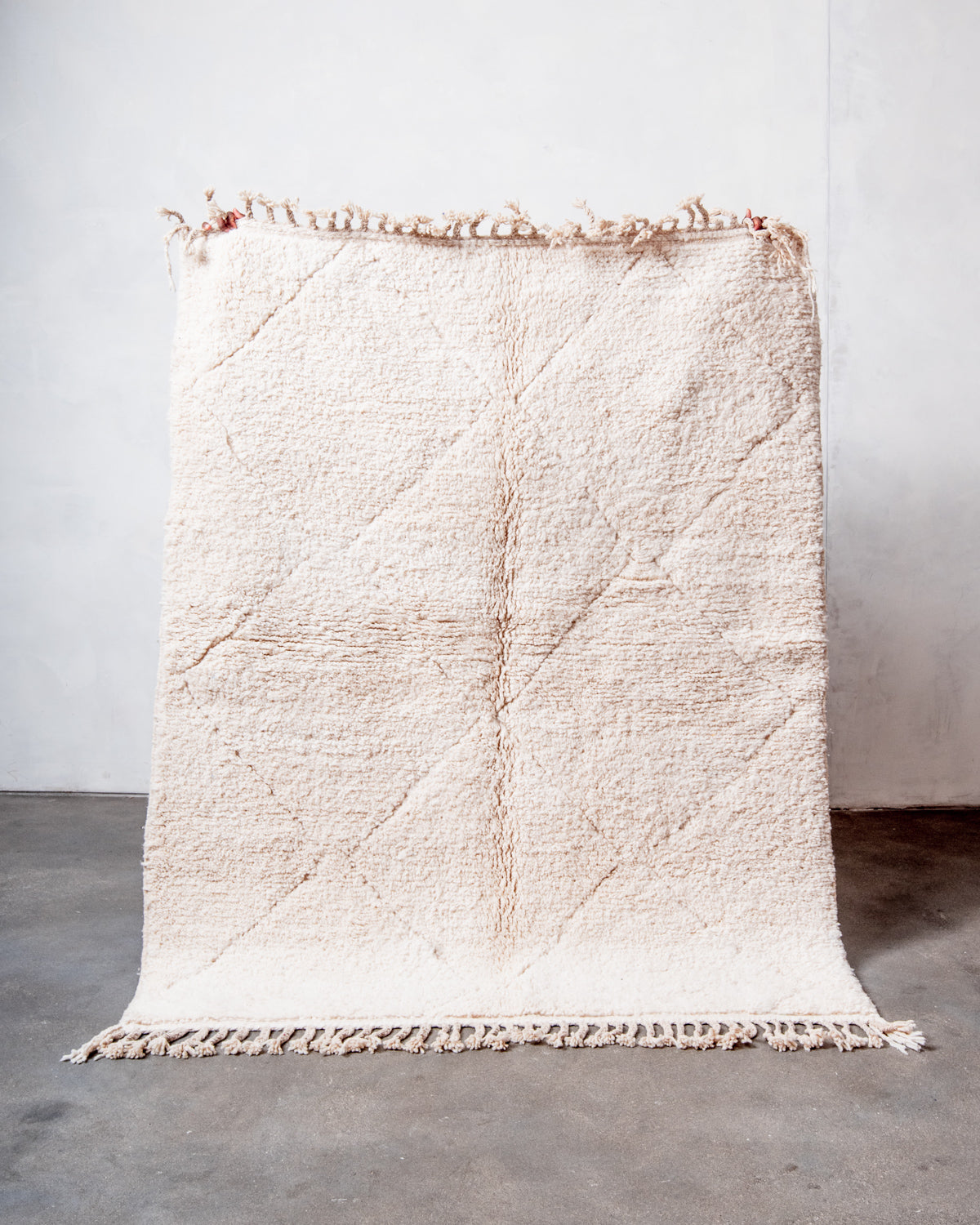 Modern, designer, handcrafted Berber rug from Morocco. Beniourain carpet with minimalist design, natural wool pile and a fluffy texture.