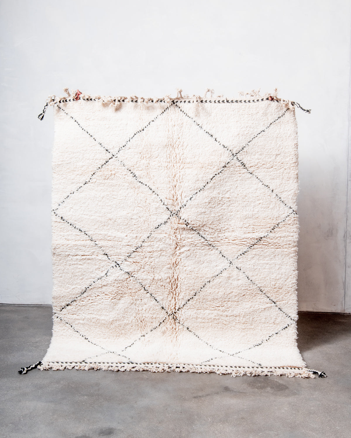 Modern, designer, handcrafted Berber rug from Morocco. Beniourain carpet with minimalist design, natural wool pile and a fluffy texture.