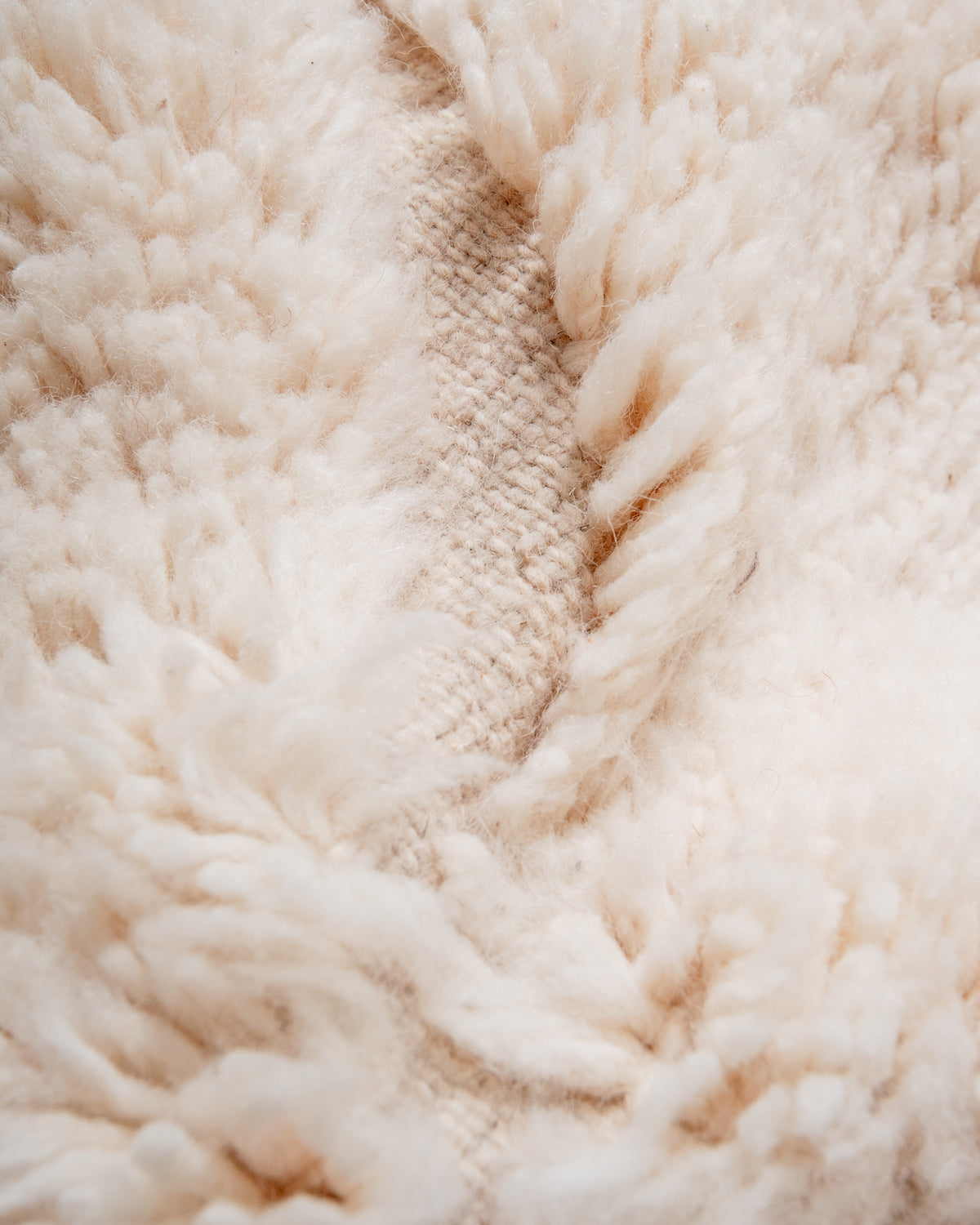 Modern, designer, handcrafted Berber rug from Morocco. Beniourain carpet with minimalist design, natural wool pile and a fluffy texture.