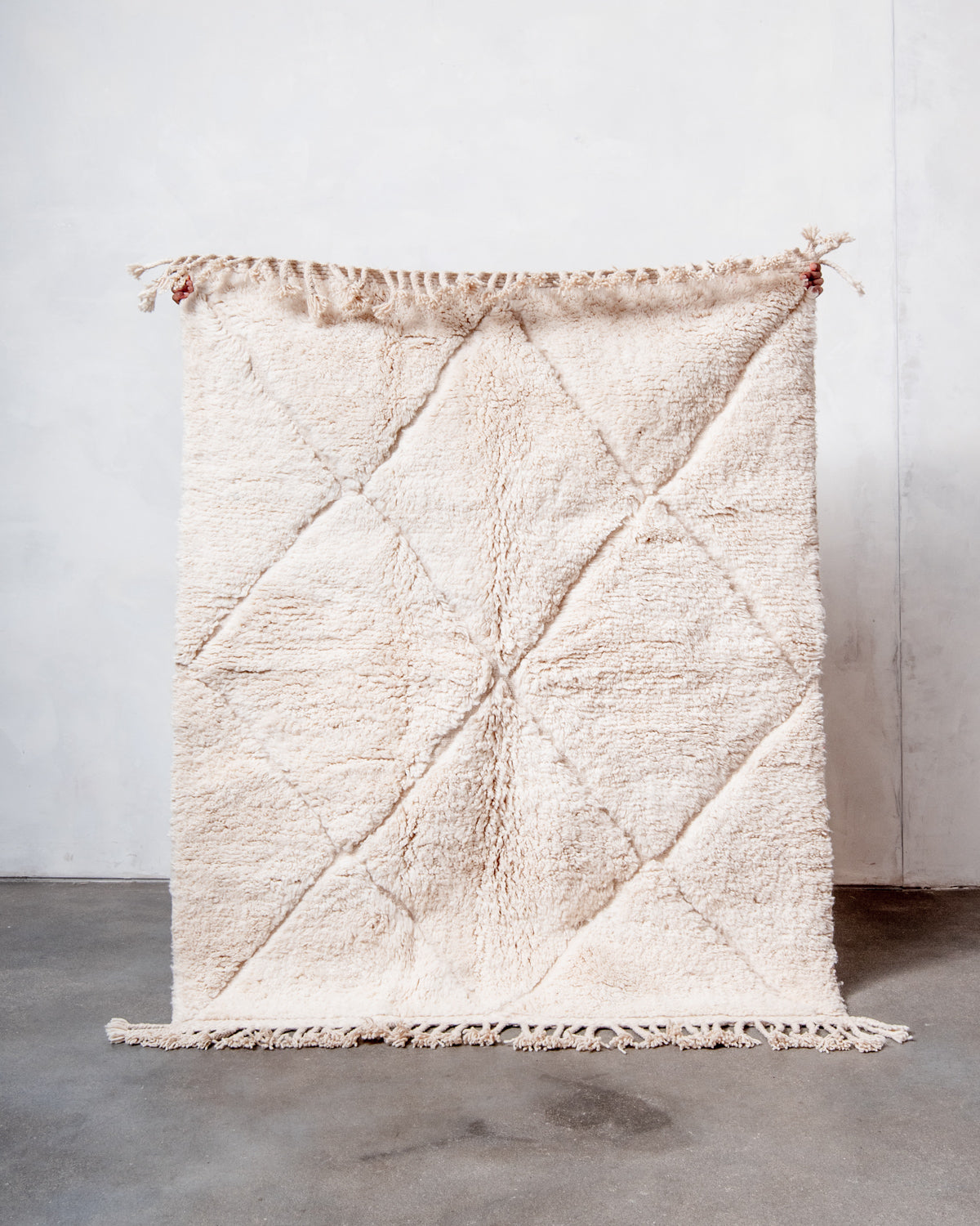 Modern, designer, handcrafted Berber rug from Morocco. Beniourain carpet with minimalist design, natural wool pile and a fluffy texture.