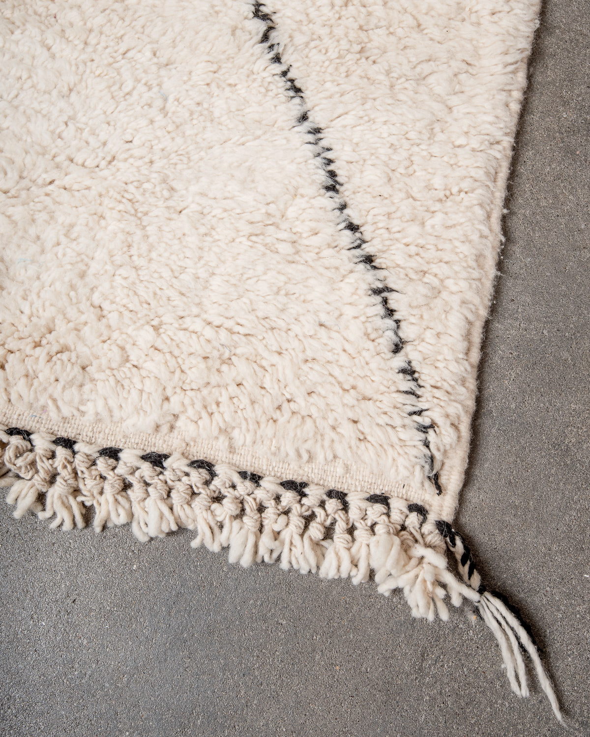 Modern, designer, handcrafted Berber rug from Morocco. Beniourain carpet with minimalist design, natural wool pile and a fluffy texture.