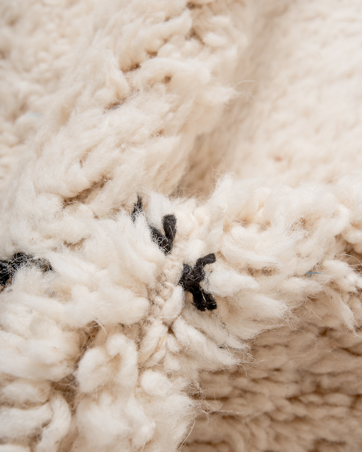 Modern, designer, handcrafted Berber rug from Morocco. Beniourain carpet with minimalist design, natural wool pile and a fluffy texture.