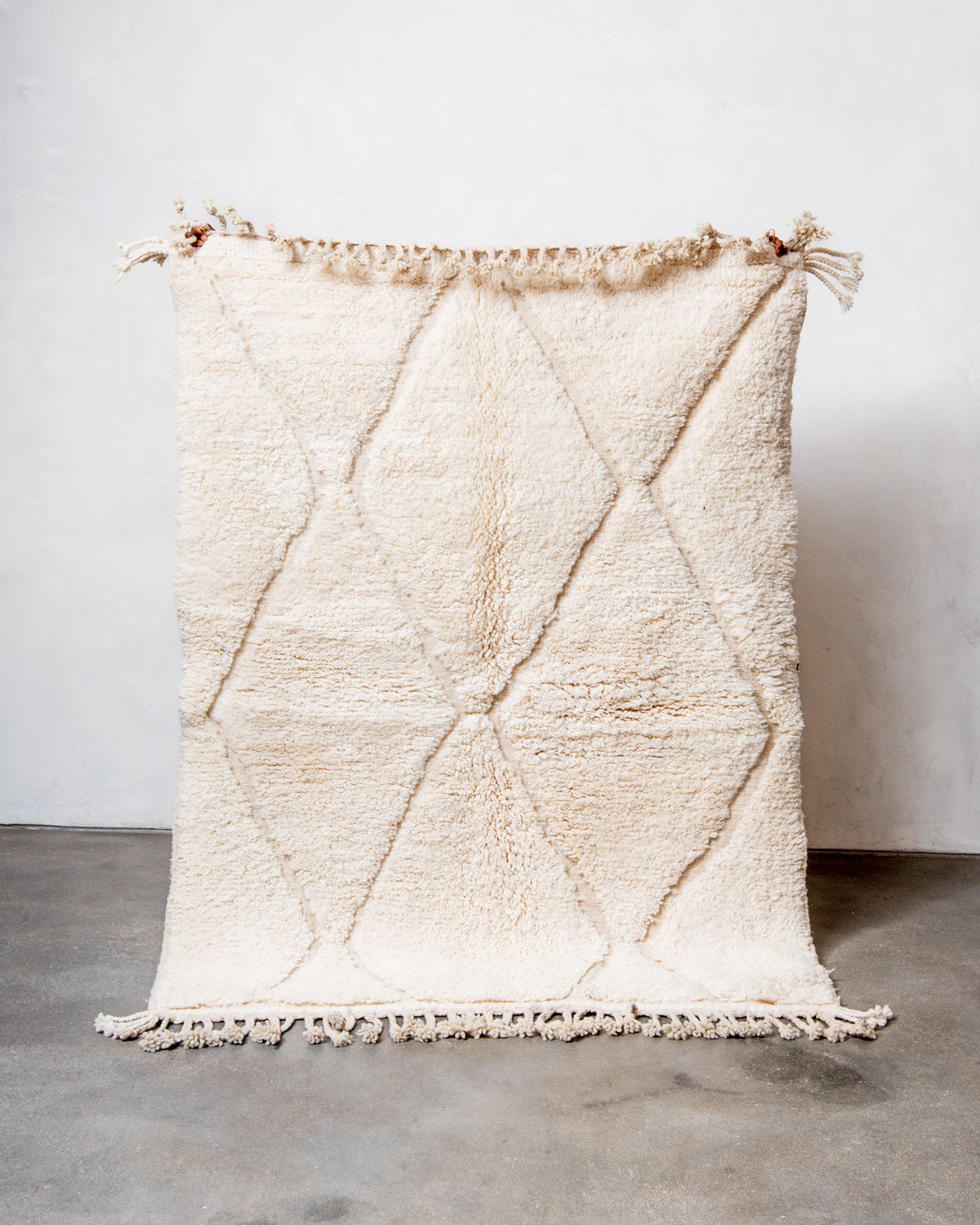 Modern, designer, handcrafted Berber rug from Morocco. Beniourain carpet with minimalist design, natural wool pile and a fluffy texture.