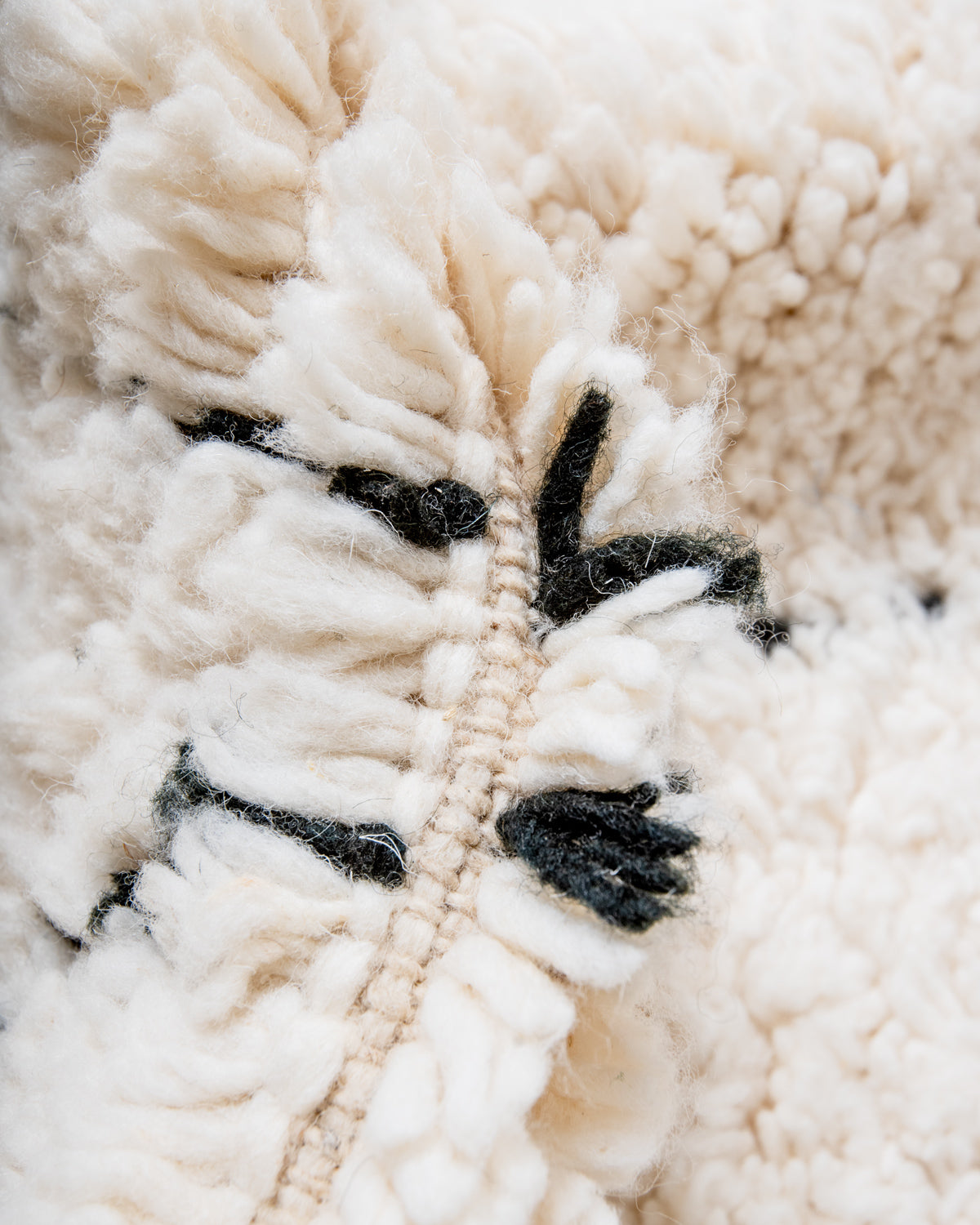 Modern, designer, handcrafted Berber rug from Morocco. Beniourain carpet with minimalist design, natural wool pile and a fluffy texture.