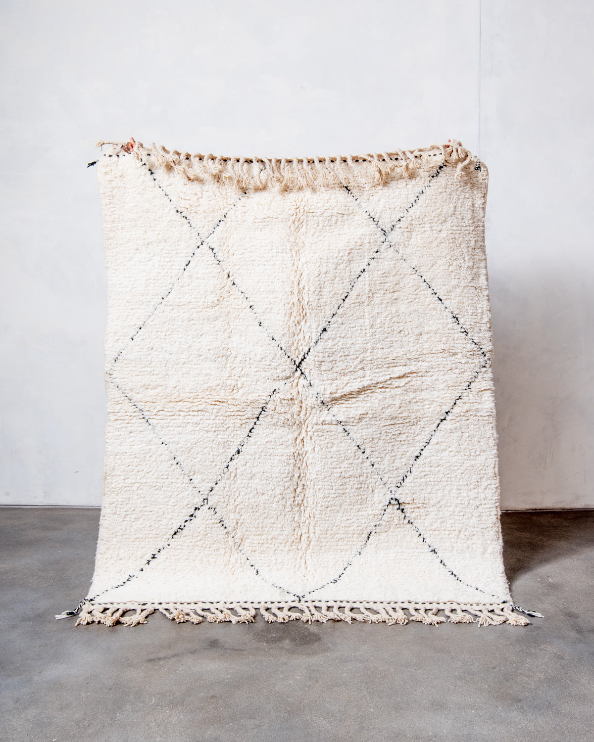 Modern, designer, handcrafted Berber rug from Morocco. Beniourain carpet with minimalist design, natural wool pile and a fluffy texture.