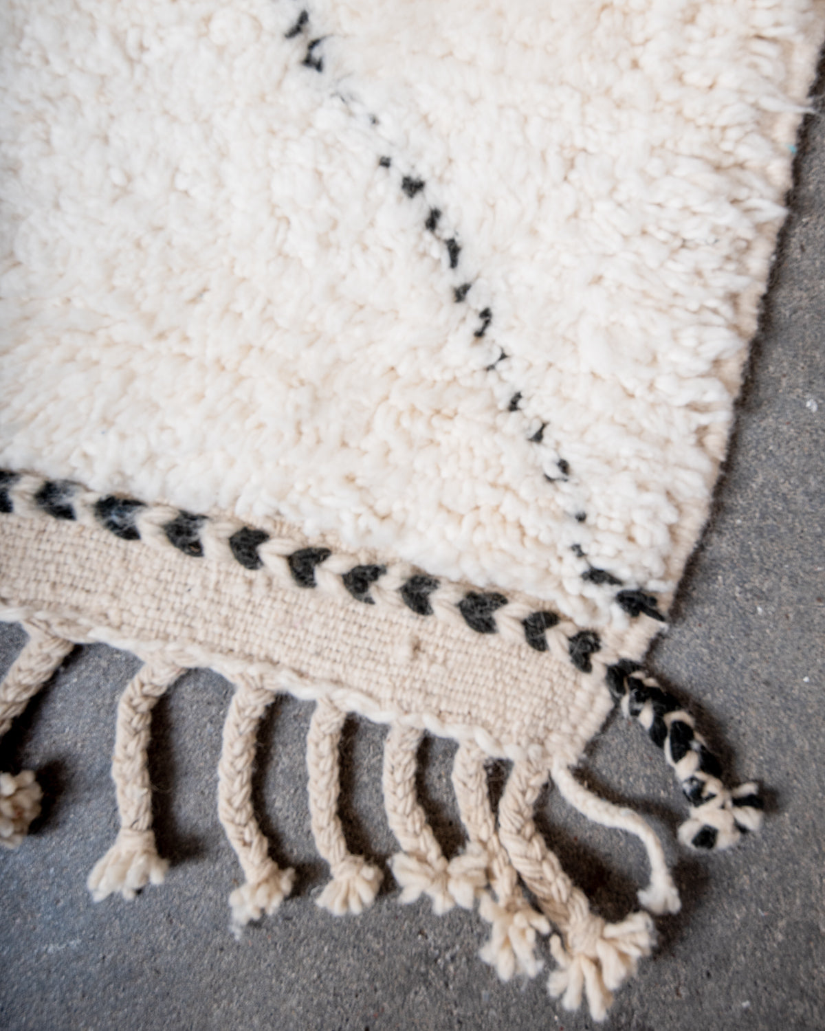 Modern, designer, handcrafted Berber rug from Morocco. Beniourain carpet with minimalist design, natural wool pile and a fluffy texture.