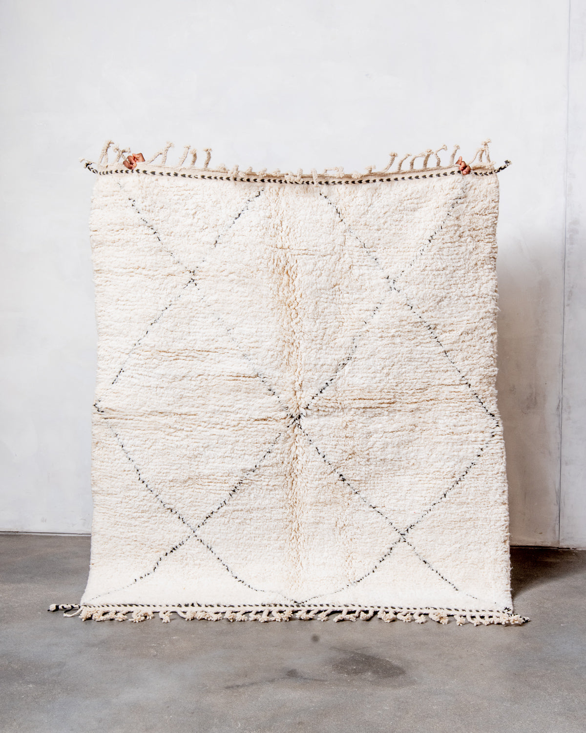 Modern, designer, handcrafted Berber rug from Morocco. Beniourain carpet with minimalist design, natural wool pile and a fluffy texture.