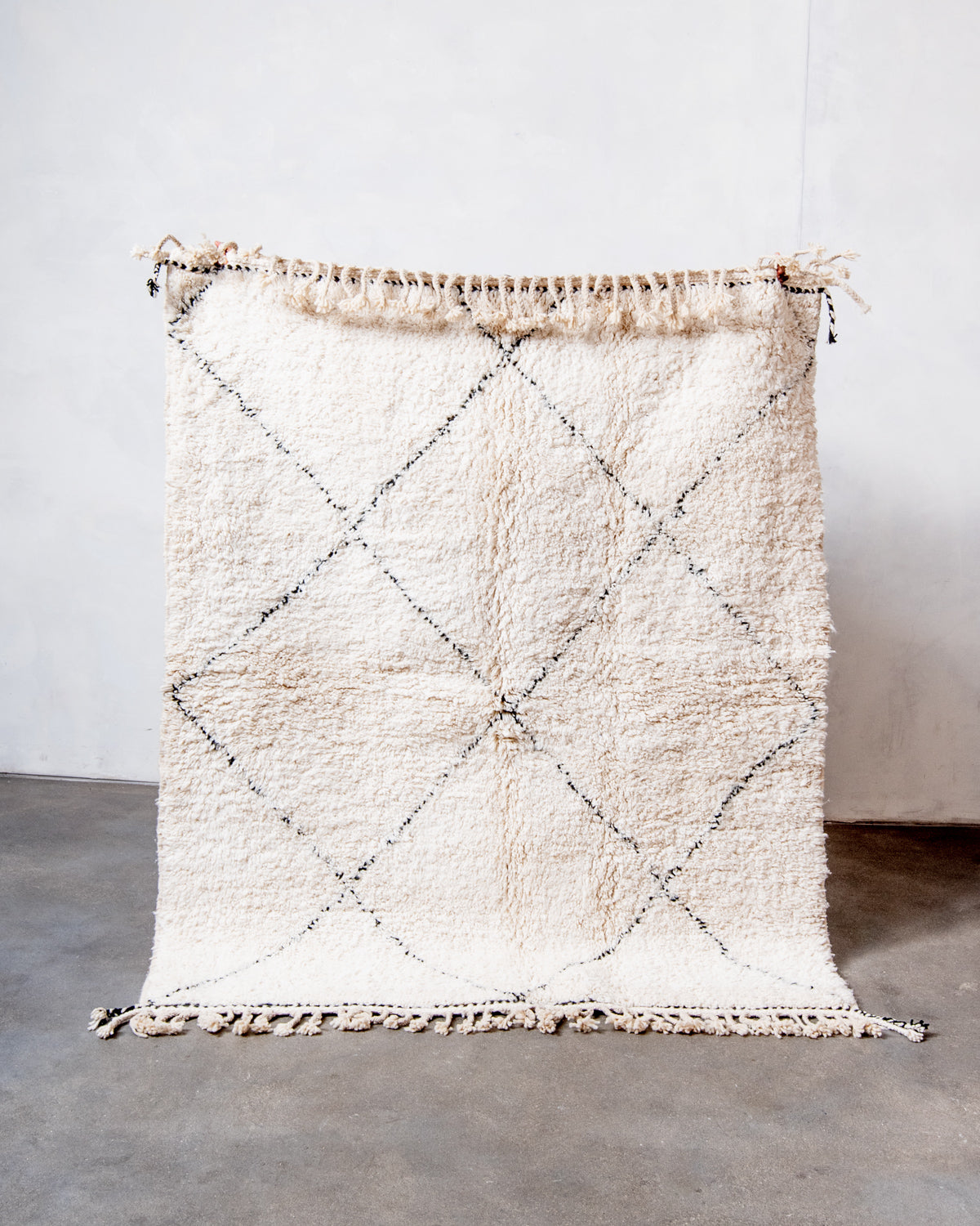 Modern, designer, handcrafted Berber rug from Morocco. Beniourain carpet with minimalist design, natural wool pile and a fluffy texture.