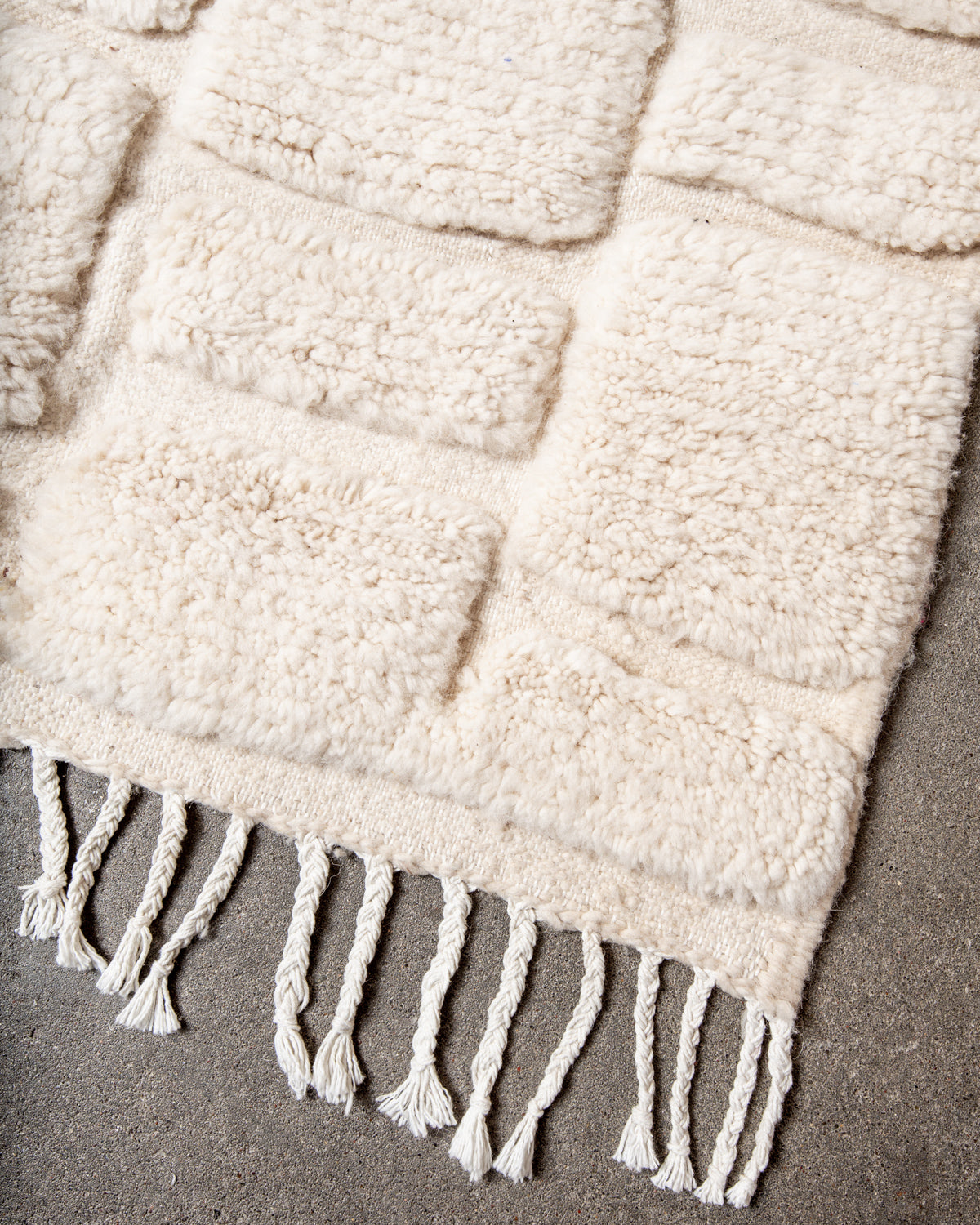 Modern, designer, handcrafted Berber rug from Morocco. Beniourain carpet with minimalist design, natural wool pile and a fluffy texture.