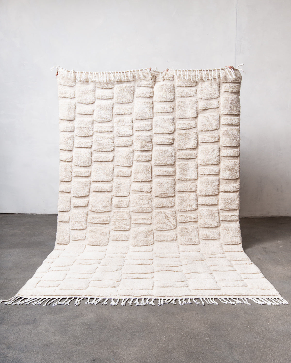 Modern, designer, handcrafted Berber rug from Morocco. Beniourain carpet with minimalist design, natural wool pile and a fluffy texture.