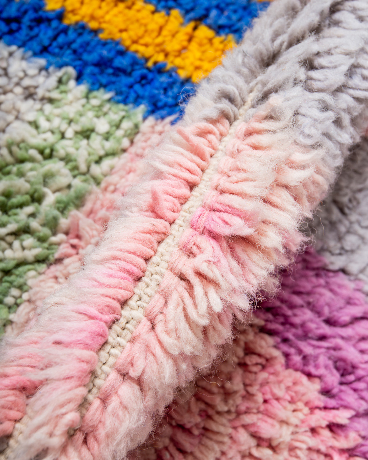 Modern, designer, handcrafted Berber rug from Morocco. Beniourain carpet with beautiful colours and patterns and fluffy wool texture.