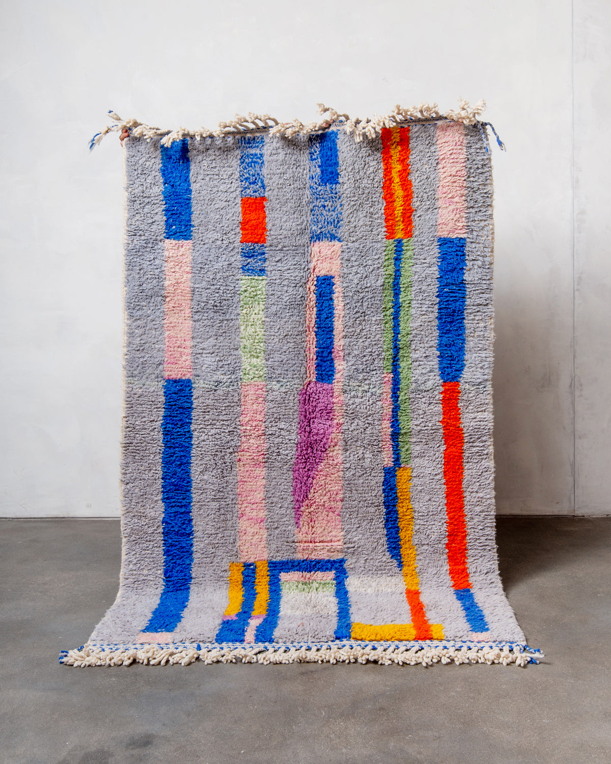 Modern, designer, handcrafted Berber rug from Morocco. Beniourain carpet with beautiful colours and patterns and fluffy wool texture.