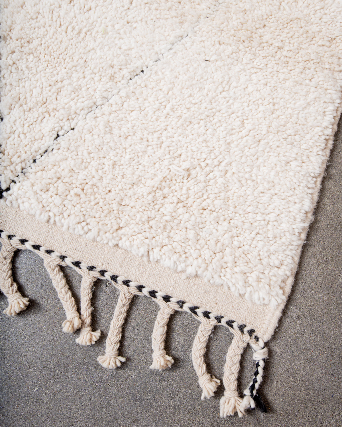Modern, designer, handcrafted Berber rug from Morocco. Beniourain carpet with minimalist design, natural wool pile and a fluffy texture.