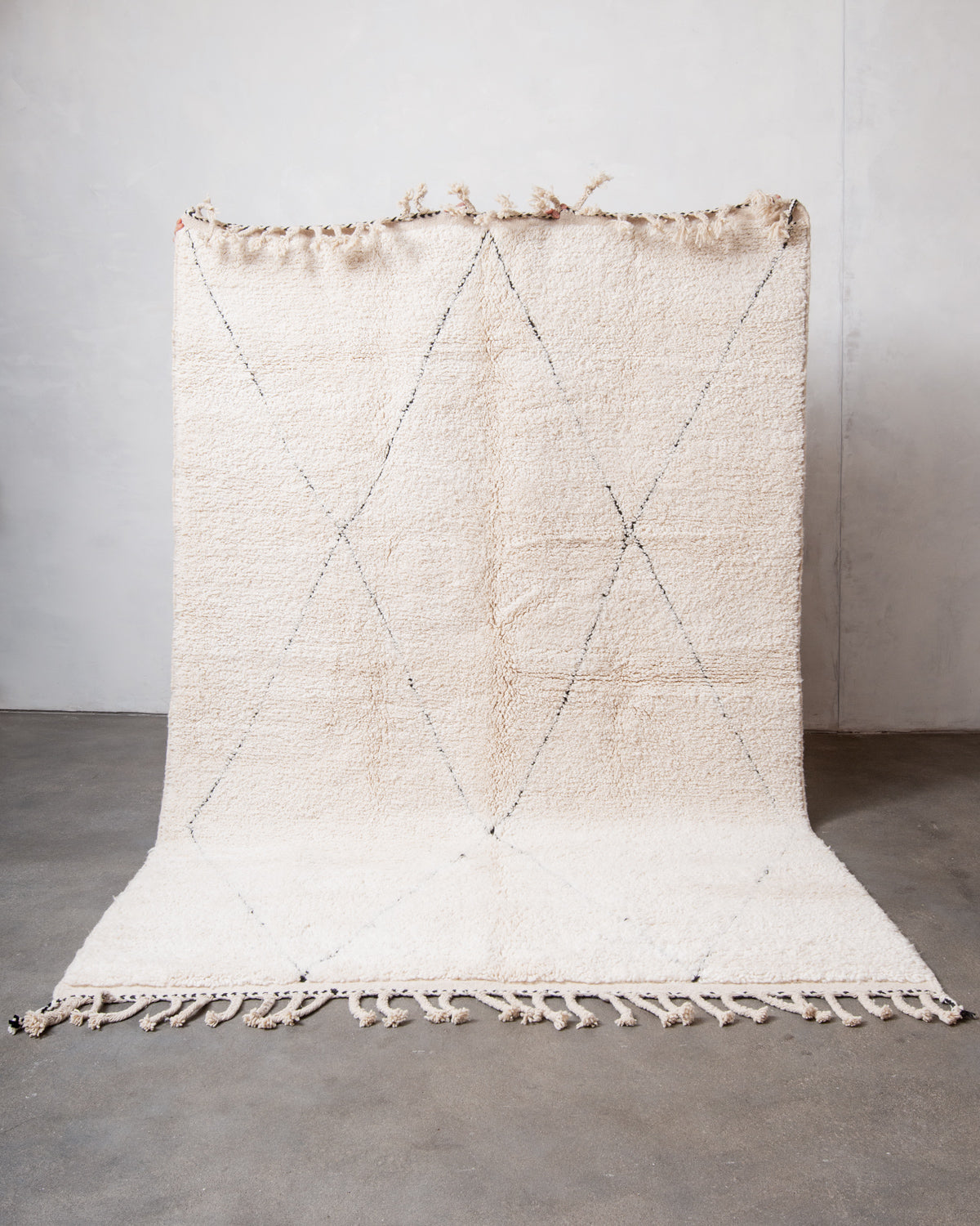 Modern, designer, handcrafted Berber rug from Morocco. Beniourain carpet with minimalist design, natural wool pile and a fluffy texture.