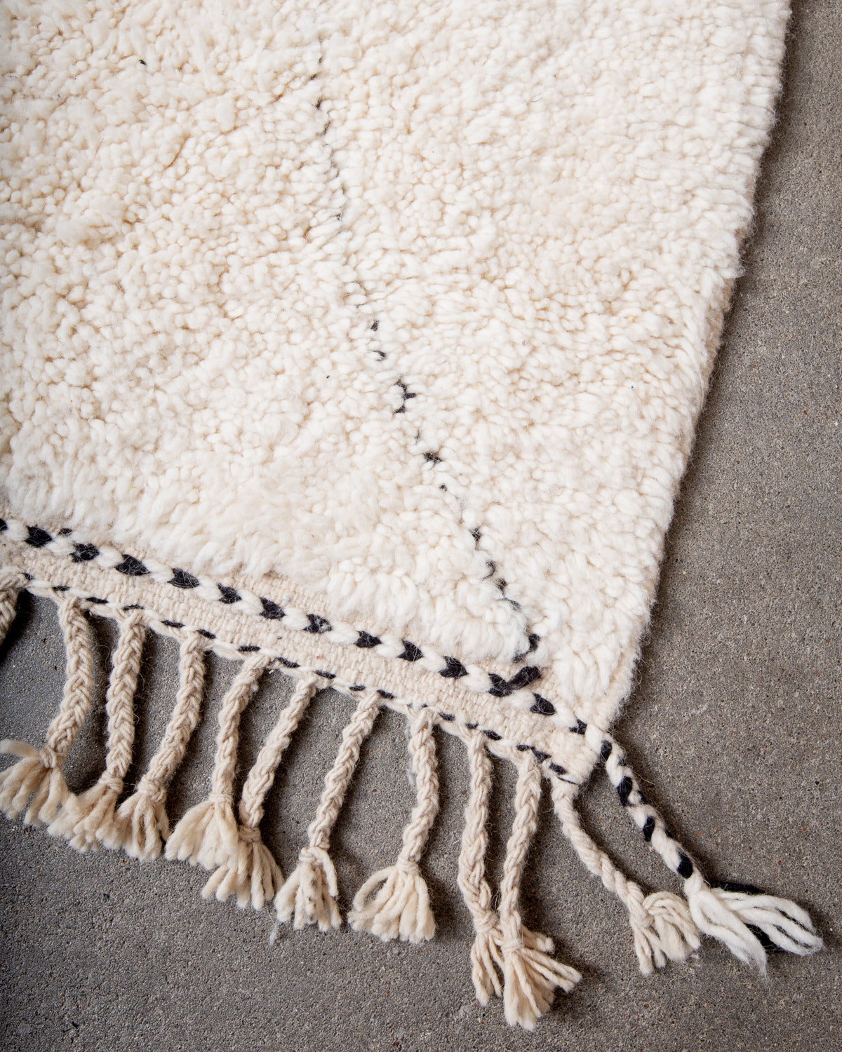 Modern, designer, handcrafted Berber rug from Morocco. Beniourain carpet with minimalist design, natural wool pile and a fluffy texture.