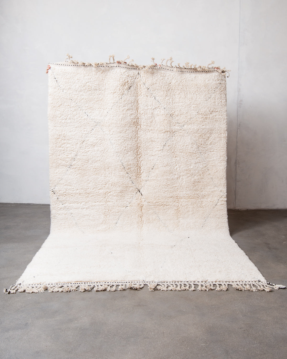 Modern, designer, handcrafted Berber rug from Morocco. Beniourain carpet with minimalist design, natural wool pile and a fluffy texture.