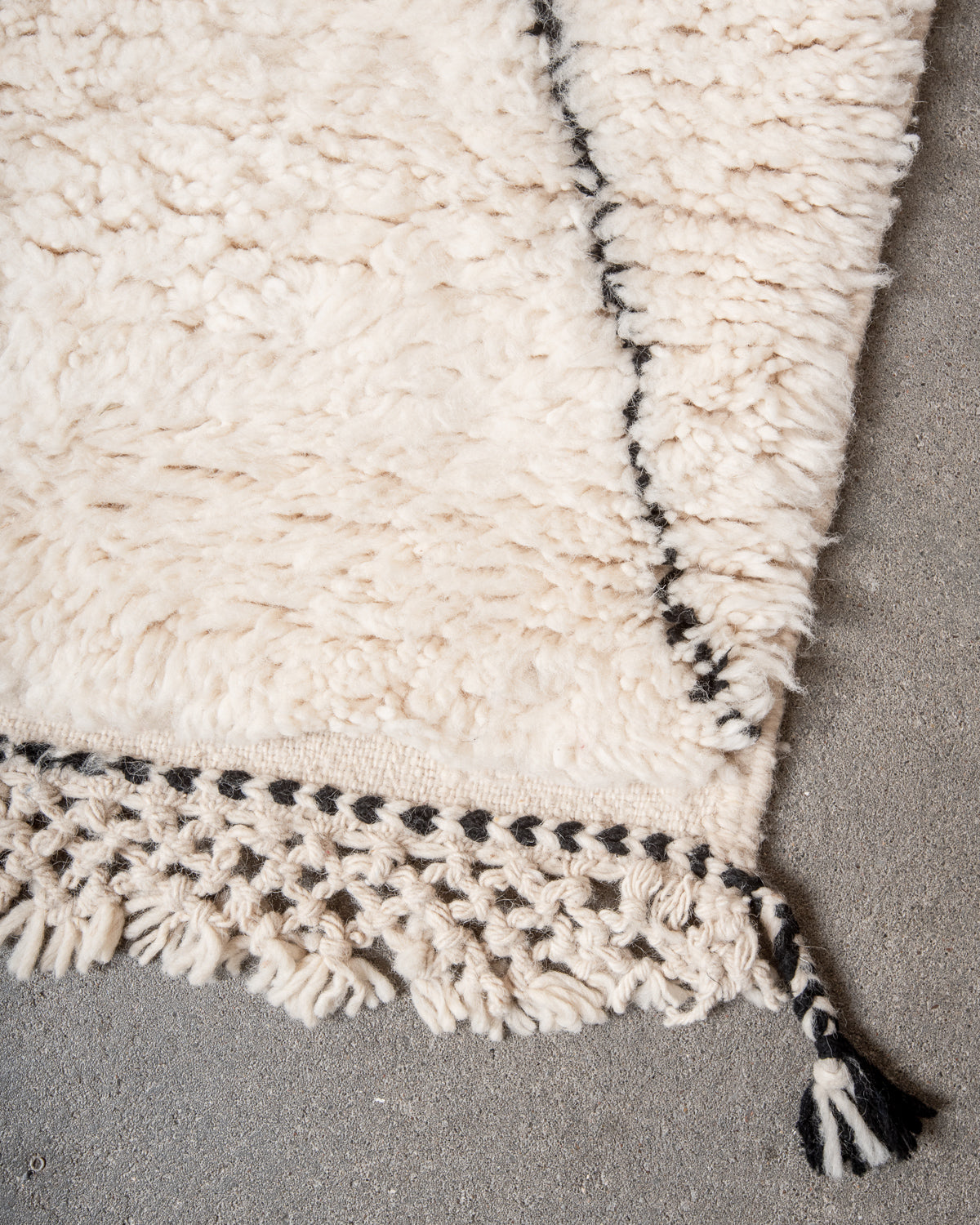 Modern, designer, handcrafted Berber rug from Morocco. Beniourain carpet with minimalist design, natural wool pile and a fluffy texture.