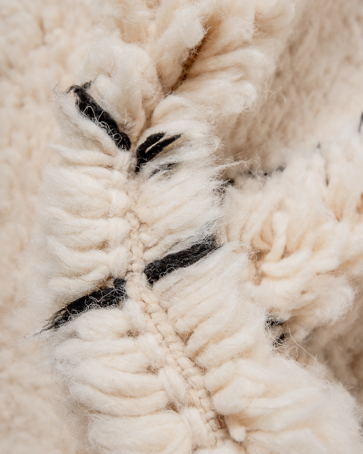 Modern, designer, handcrafted Berber rug from Morocco. Beniourain carpet with minimalist design, natural wool pile and a fluffy texture.