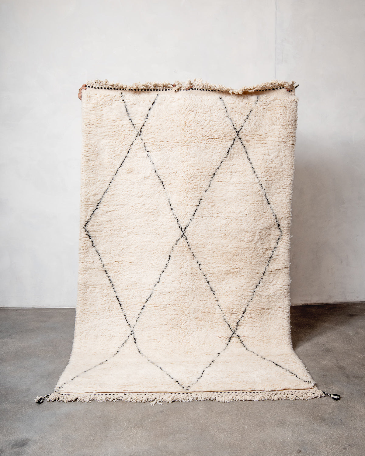 Modern, designer, handcrafted Berber rug from Morocco. Beniourain carpet with minimalist design, natural wool pile and a fluffy texture.