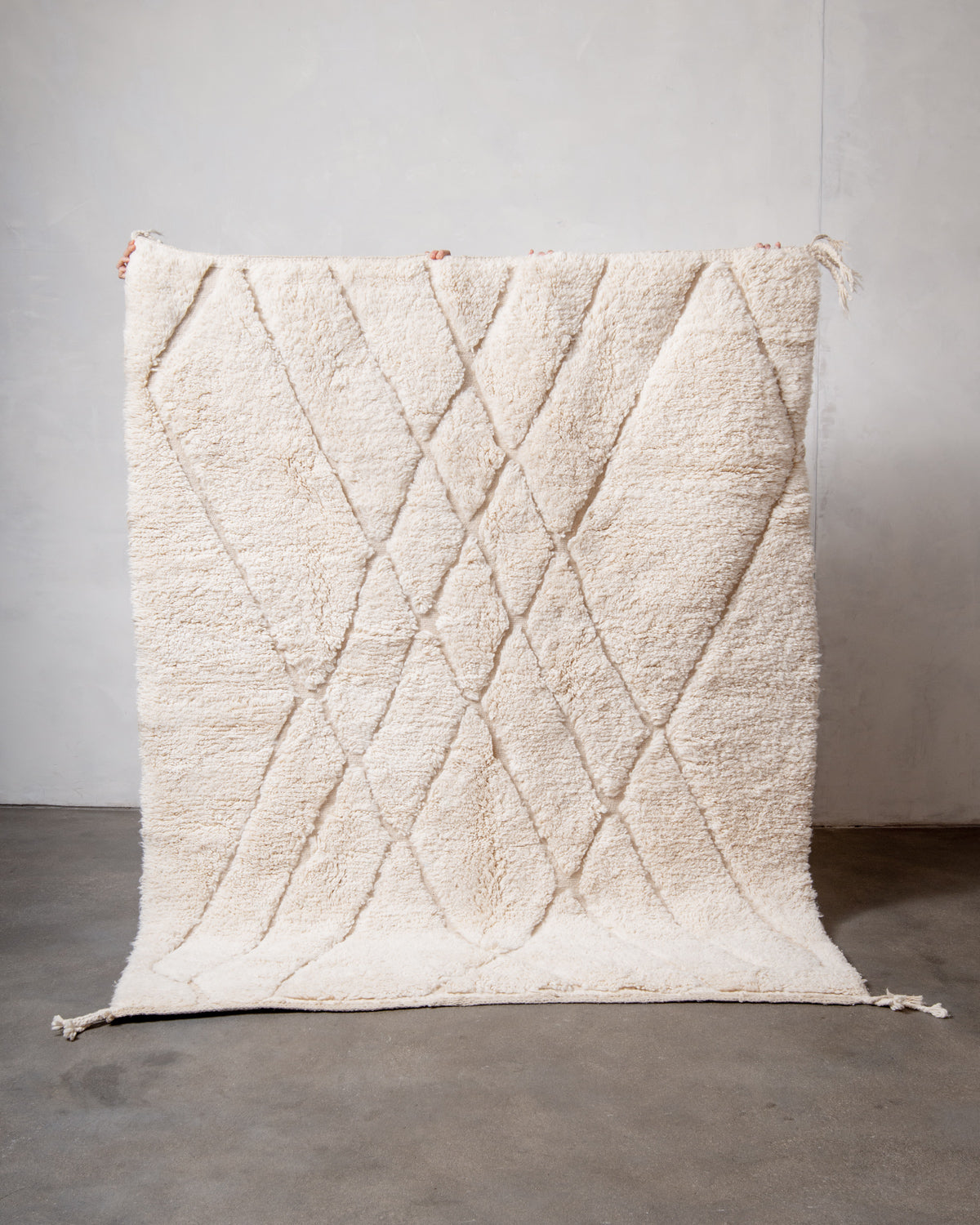 Modern, designer, handcrafted Berber rug from Morocco. Beniourain carpet with minimalist design, natural wool pile and a fluffy texture.