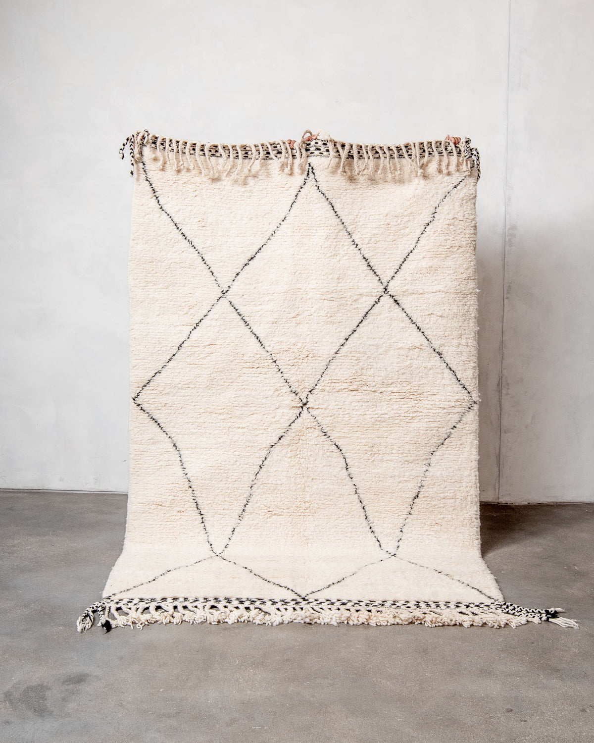 Modern, designer, handcrafted Berber rug from Morocco. Beniourain carpet with minimalist design, natural wool pile and a fluffy texture.