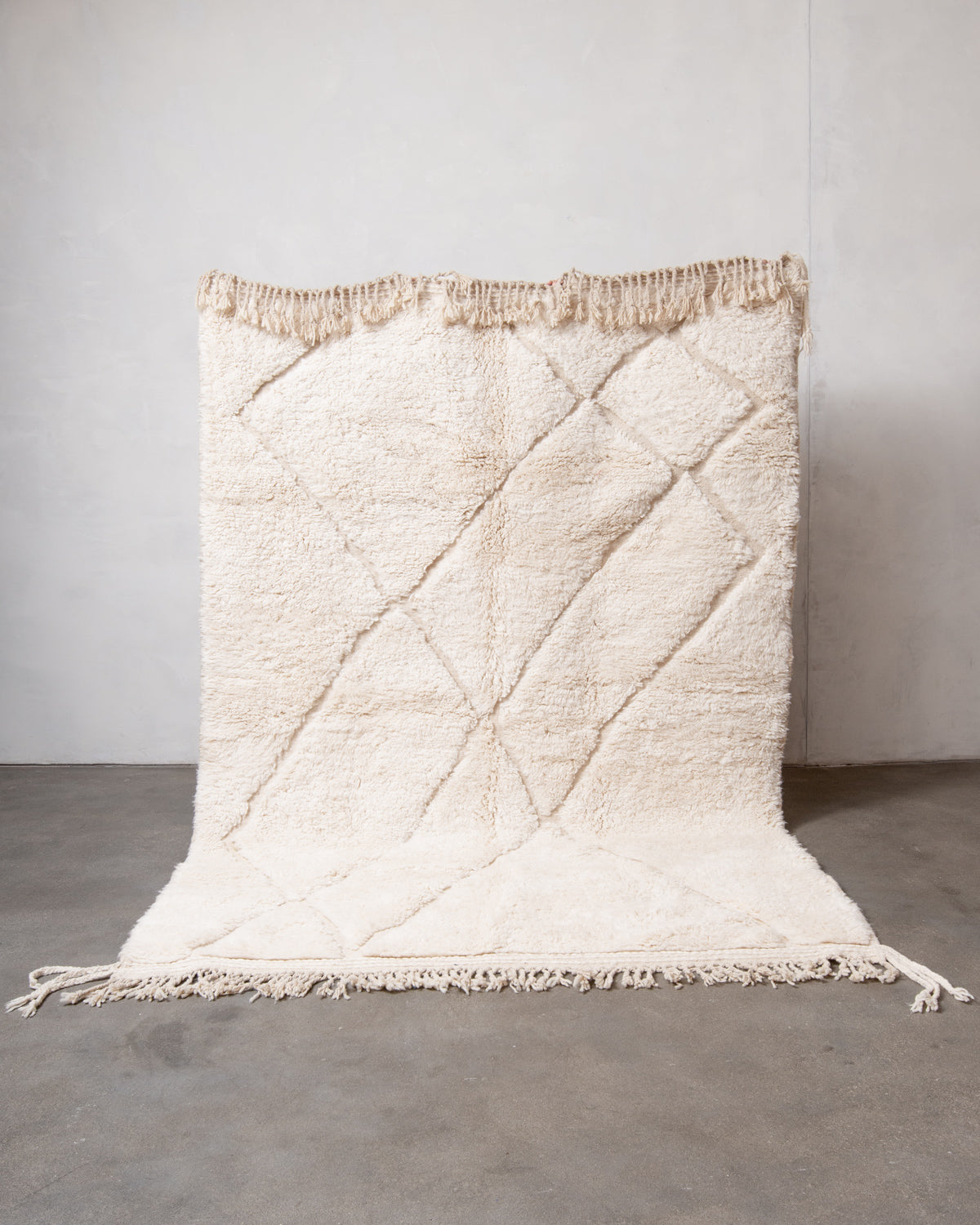 Modern, designer, handcrafted Berber rug from Morocco. Beniourain carpet with minimalist design, natural wool pile and a fluffy texture.