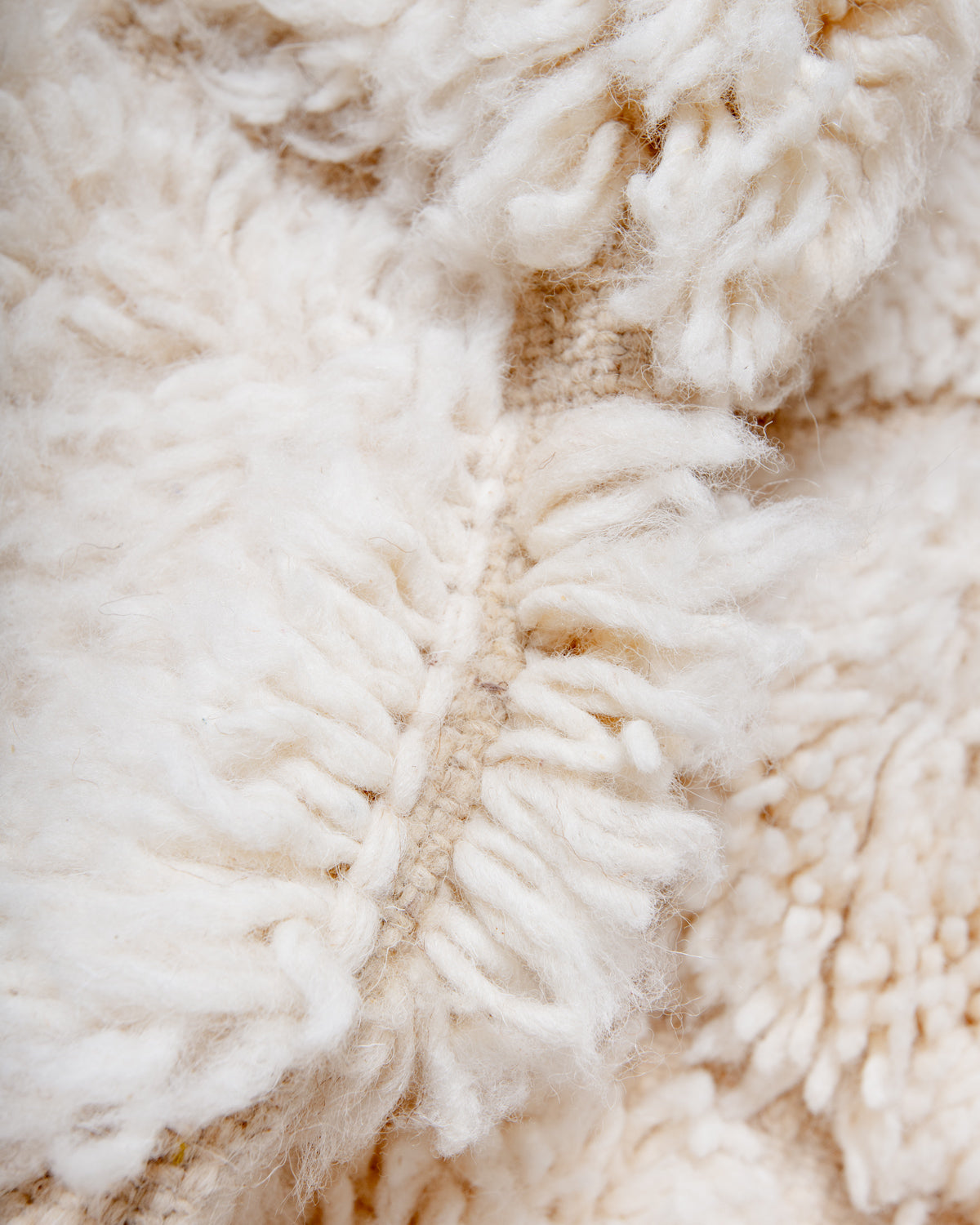 Modern, designer, handcrafted Berber rug from Morocco. Beniourain carpet with minimalist design, natural wool pile and a fluffy texture.