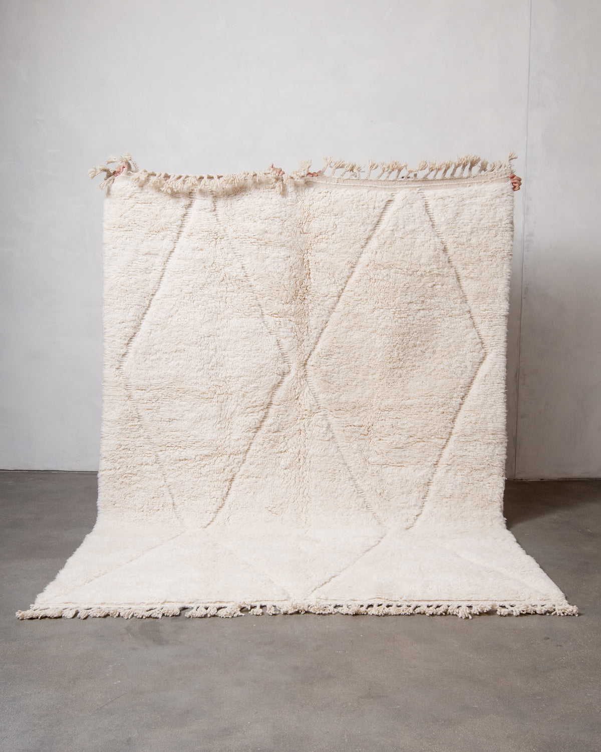 Modern, designer, handcrafted Berber rug from Morocco. Beniourain carpet with minimalist design, natural wool pile and a fluffy texture.