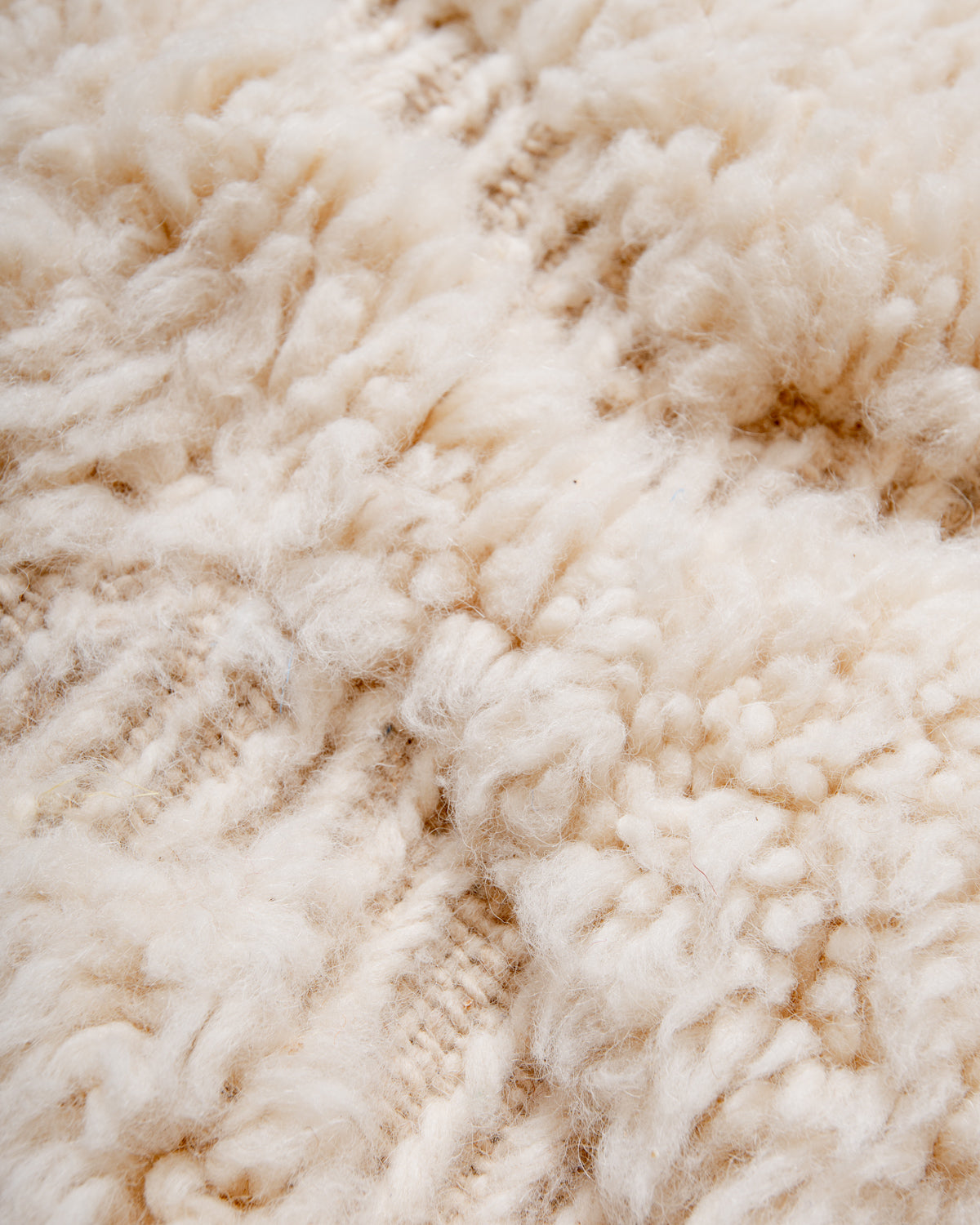 Modern, designer, handcrafted Berber rug from Morocco. Beniourain carpet with minimalist design, natural wool pile and a fluffy texture.