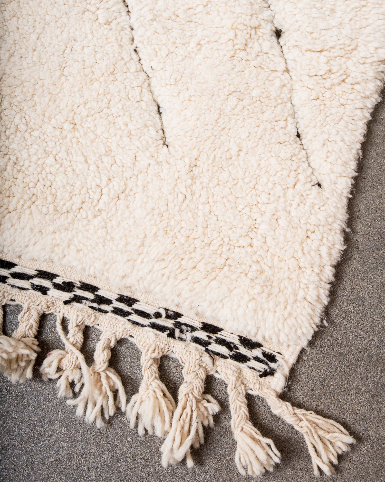 Modern, designer, handcrafted Berber rug from Morocco. Beniourain carpet with minimalist design, natural wool pile and a fluffy texture.