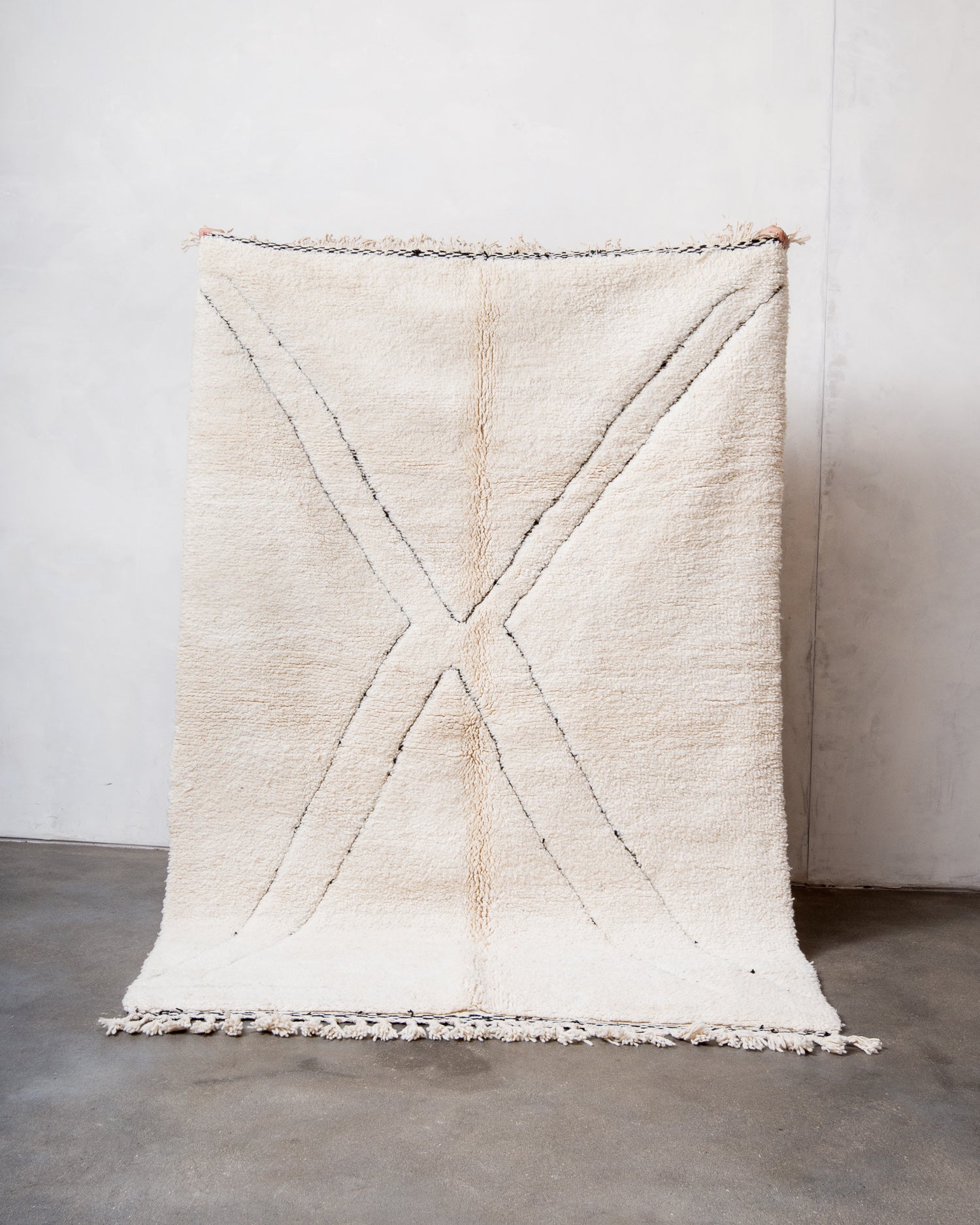 Modern, designer, handcrafted Berber rug from Morocco. Beniourain carpet with minimalist design, natural wool pile and a fluffy texture.