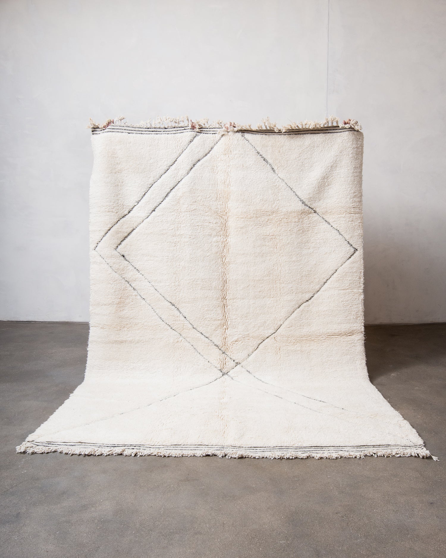 Modern, designer, handcrafted Berber rug from Morocco. Beniourain carpet with minimalist design, natural wool pile and a fluffy texture.