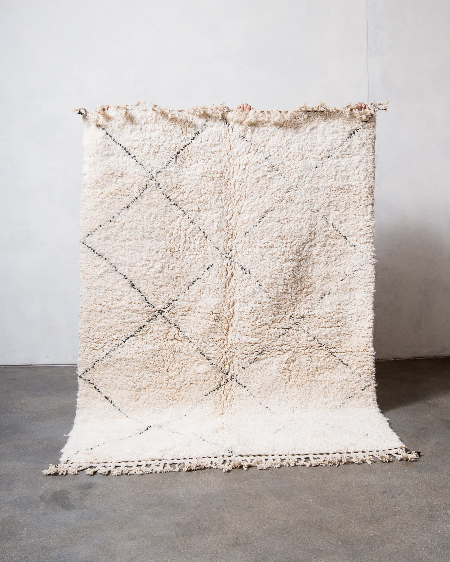 Modern, designer, handcrafted Berber rug from Morocco. Beniourain carpet with minimalist design, natural wool pile and a fluffy texture.