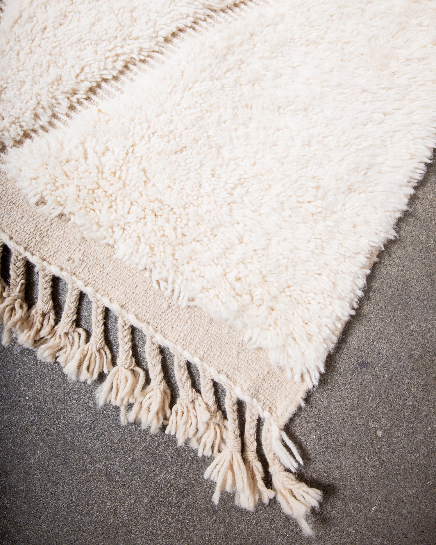 Modern, designer, handcrafted Berber rug from Morocco. Beniourain carpet with minimalist design, natural wool pile and a fluffy texture.