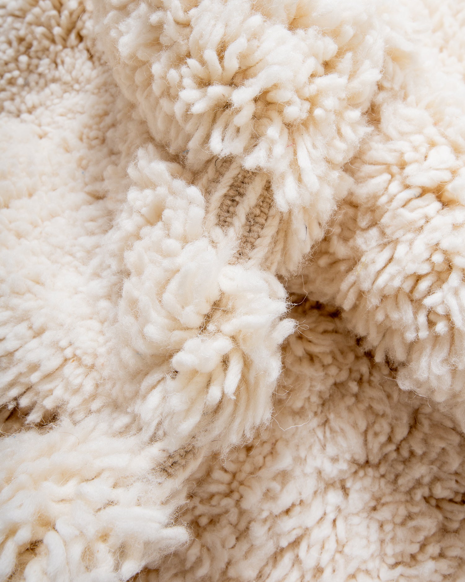 Modern, designer, handcrafted Berber rug from Morocco. Beniourain carpet with minimalist design, natural wool pile and a fluffy texture.