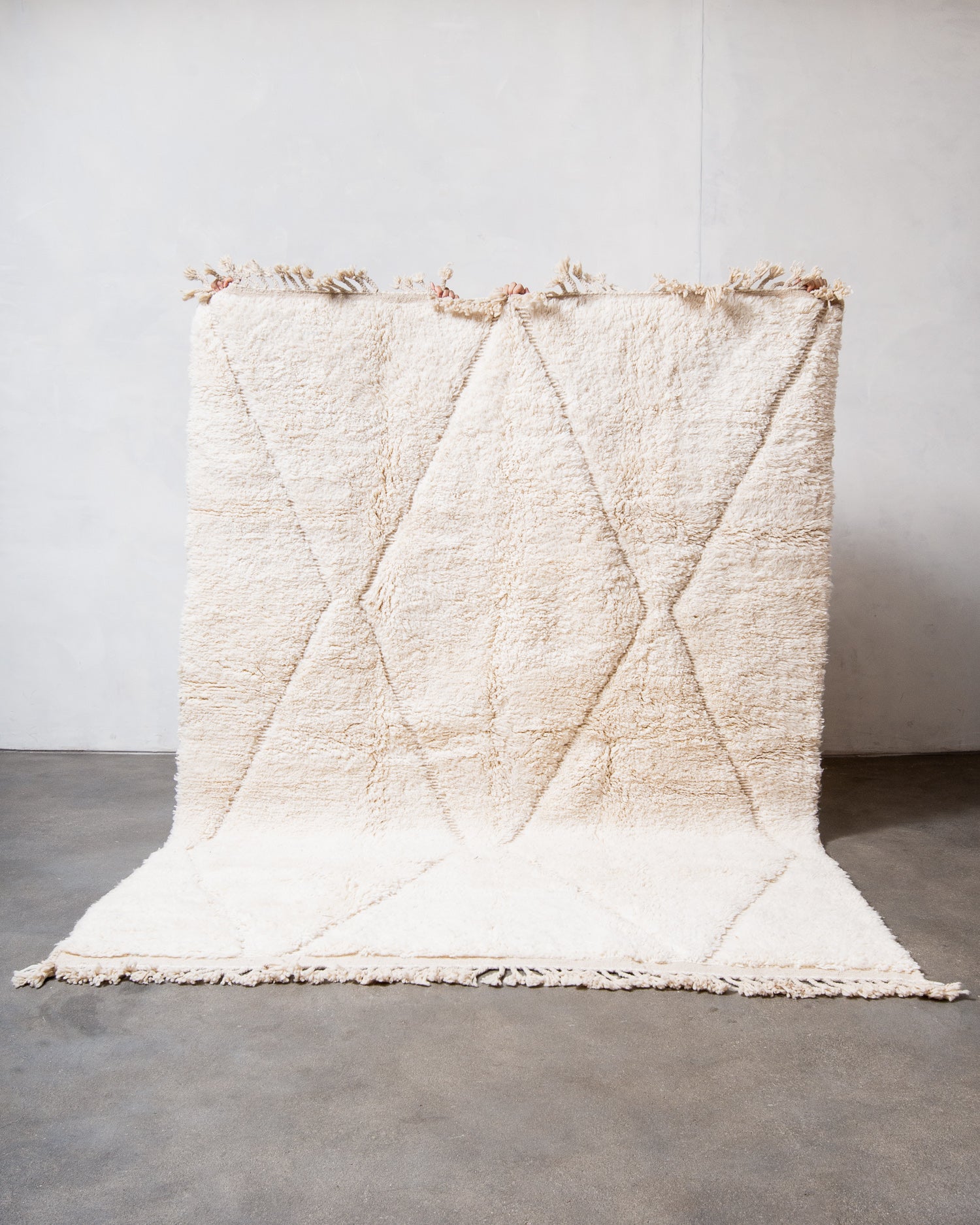 Modern, designer, handcrafted Berber rug from Morocco. Beniourain carpet with minimalist design, natural wool pile and a fluffy texture.