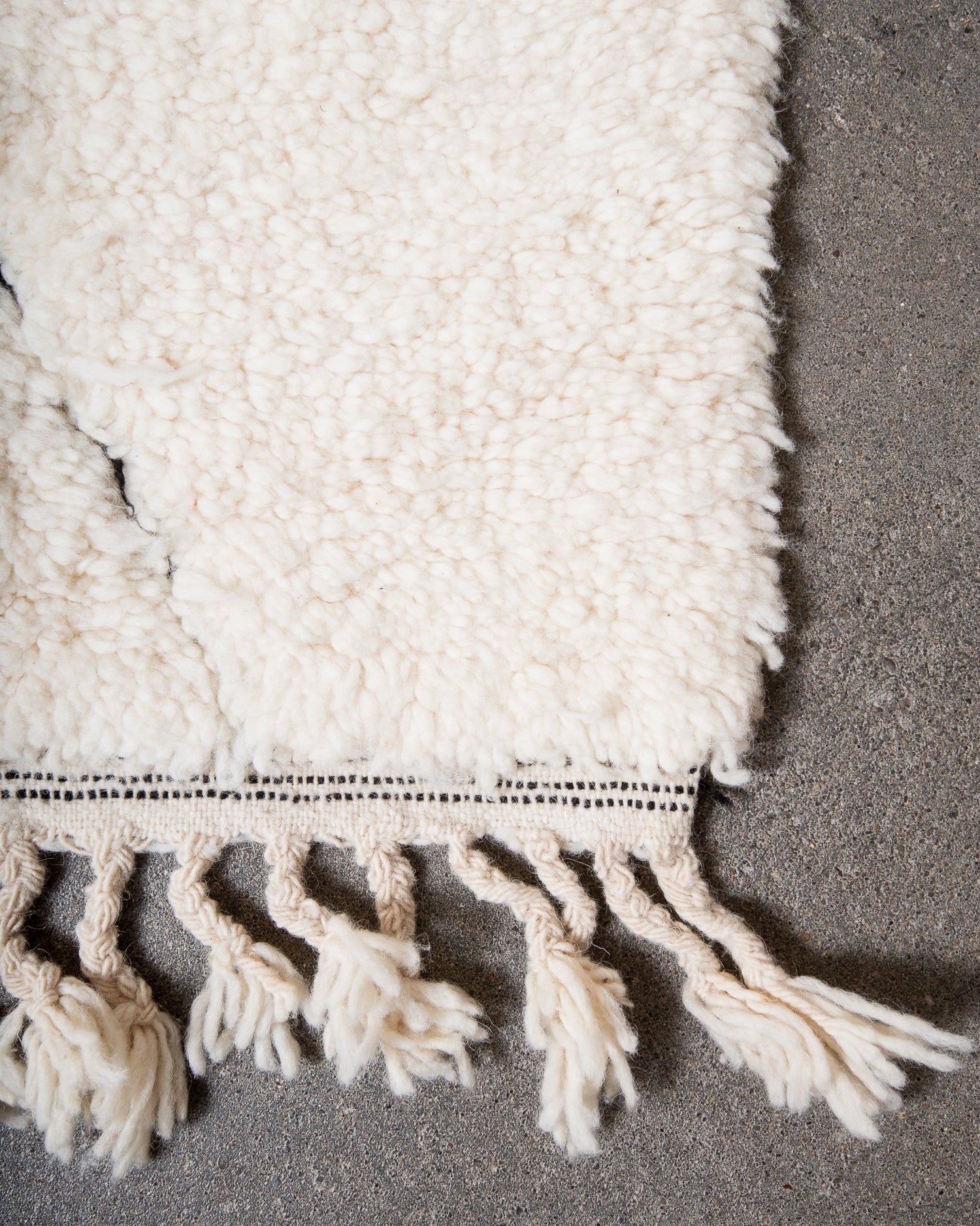 Modern, designer, handcrafted Berber rug from Morocco. Beniourain carpet with minimalist design, natural wool pile and a fluffy texture.
