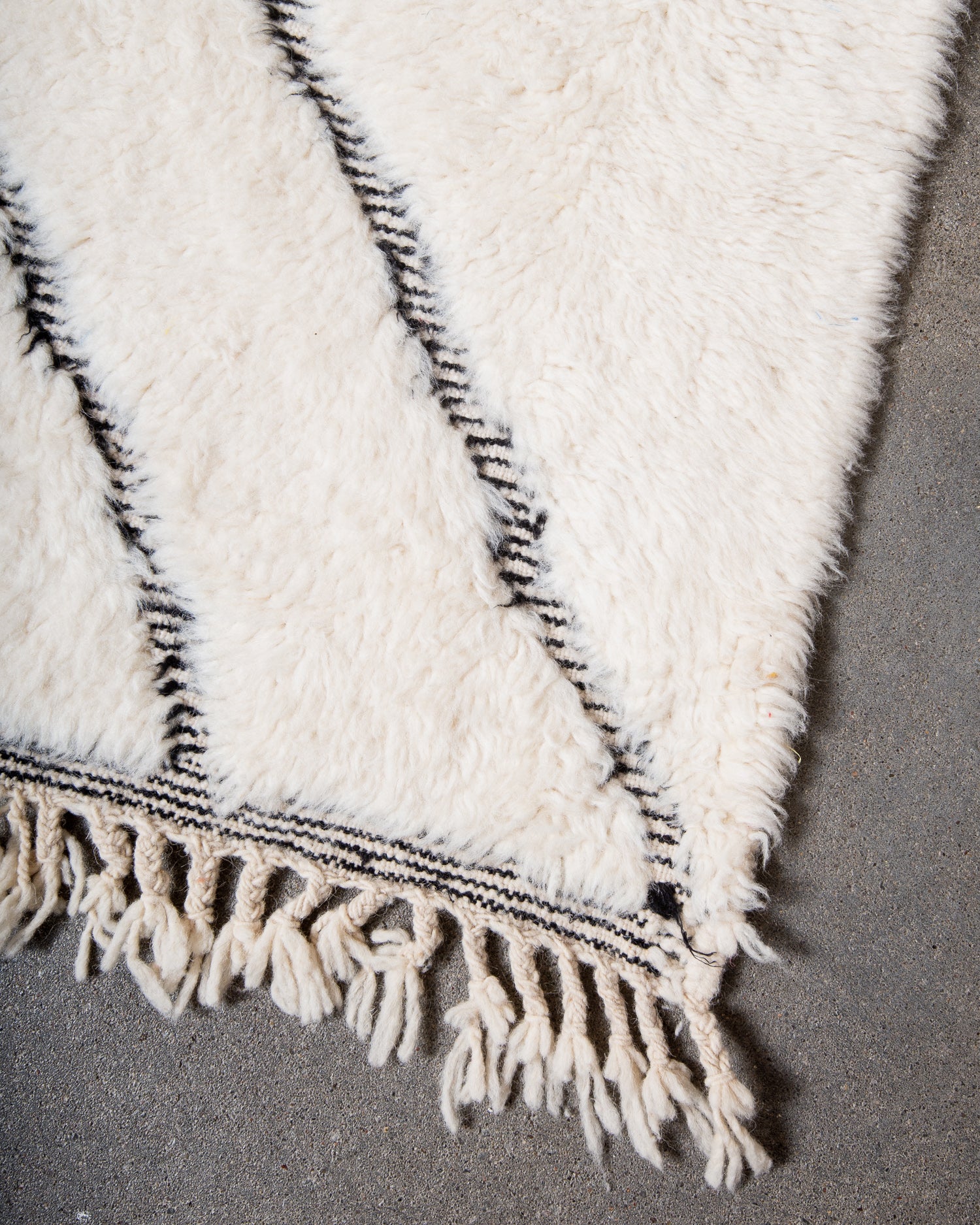 Modern, designer, handcrafted Berber rug from Morocco. Beniourain carpet with minimalist design, natural wool pile and a fluffy texture.