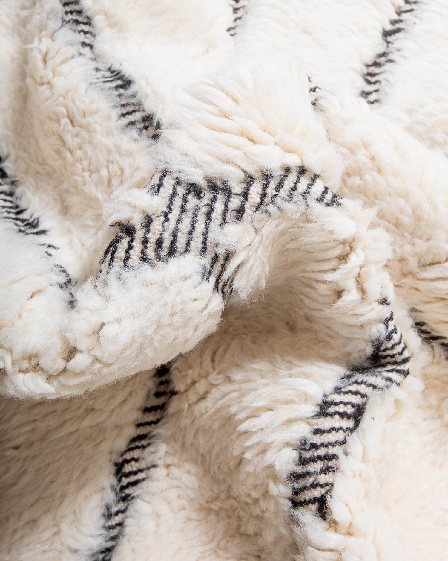 Modern, designer, handcrafted Berber rug from Morocco. Beniourain carpet with minimalist design, natural wool pile and a fluffy texture.